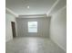 Spacious main bedroom with a tray ceiling and plenty of natural light at 4910 Lyric Dr, Mascotte, FL 34753