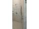 This modern shower features sleek hardware, marble tile, and convenient shelving for a spa-like feel at 4910 Lyric Dr, Mascotte, FL 34753