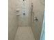 Shower area featuring sleek fixtures, built-in shelving, and marble-look tile at 4910 Lyric Dr, Mascotte, FL 34753