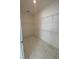 Spacious walk-in closet with ample storage space and wire shelving, perfect for organization at 4910 Lyric Dr, Mascotte, FL 34753