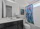 Bathroom featuring single sink vanity and Avengers themed shower curtain at 9001 Flamingo Key Way, Kissimmee, FL 34747