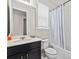 Cozy bathroom featuring a shower-tub combo with white tile surround at 9001 Flamingo Key Way, Kissimmee, FL 34747