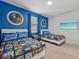 The bedroom features Star Wars themed linens and decor and two beds at 9001 Flamingo Key Way, Kissimmee, FL 34747