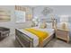Stylishly decorated bedroom features a mirrored bedframe, matching end tables, and modern decor at 9001 Flamingo Key Way, Kissimmee, FL 34747