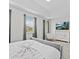 Bright bedroom featuring a tray ceiling, TV, and neutral colors at 9001 Flamingo Key Way, Kissimmee, FL 34747