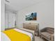 Bedroom with a comfortable chair, large dresser, and TV, offering a relaxing retreat at 9001 Flamingo Key Way, Kissimmee, FL 34747