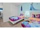 Themed bedroom with twin beds, carpeting, and colorful decor at 9001 Flamingo Key Way, Kissimmee, FL 34747