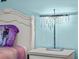 Decorated bedroom featuring a crystal table lamp on the nightstand at 9001 Flamingo Key Way, Kissimmee, FL 34747
