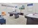 The expansive game room features a blue pool table and a vintage air hockey game at 9001 Flamingo Key Way, Kissimmee, FL 34747