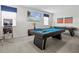 The game room features a pool table, pinball machine and a TV for entertainment at 9001 Flamingo Key Way, Kissimmee, FL 34747