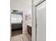 Bathroom with a tiled shower stall, dark wood vanity and a glimpse into bedroom at 2710 Manesty Ln, Kissimmee, FL 34747