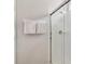 Bathroom featuring a glass-enclosed shower with white subway tiles and a towel rack at 2710 Manesty Ln, Kissimmee, FL 34747
