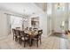 Dining room featuring a large table, with seating for ten, and an open view to the kitchen at 2710 Manesty Ln, Kissimmee, FL 34747