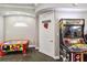The community game room features classic arcade games like air hockey, and Injustice at 2710 Manesty Ln, Kissimmee, FL 34747