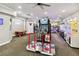 Spacious game room with arcade games and air hockey table at 2710 Manesty Ln, Kissimmee, FL 34747