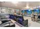Spacious home theater featuring comfortable seating, colorful LED lighting, and multiple screens at 2710 Manesty Ln, Kissimmee, FL 34747