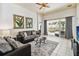 Cozy living room with comfortable seating, tile floors, and sliding glass doors to the patio at 2710 Manesty Ln, Kissimmee, FL 34747