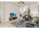 Bright and airy living room with tile flooring and comfortable sofas, perfect for relaxation at 2710 Manesty Ln, Kissimmee, FL 34747