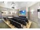 Enjoy movies in the community theater room with comfortable seating and a large screen for an immersive experience at 2710 Manesty Ln, Kissimmee, FL 34747