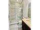 Contemporary bathroom with a glass shower, marbled tile, and modern vanity at 7443 Lake Albert Dr, Windermere, FL 34786