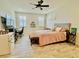 Inviting bedroom with wood-look flooring, a ceiling fan, and bright natural light at 7443 Lake Albert Dr, Windermere, FL 34786