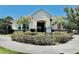 Inviting community clubhouse, front view showcasing lush landscaping and community amenities at 7443 Lake Albert Dr, Windermere, FL 34786