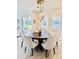 Dining area with a modern chandelier and seating for eight at 7443 Lake Albert Dr, Windermere, FL 34786
