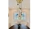 Dining area with a modern chandelier and views to the outside at 7443 Lake Albert Dr, Windermere, FL 34786