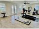 Spacious exercise room with hardwood flooring, treadmill, and stationary bike at 7443 Lake Albert Dr, Windermere, FL 34786