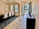 Welcoming foyer with wood-look tile floors and a view of the dining room at 7443 Lake Albert Dr, Windermere, FL 34786