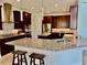 Gourmet kitchen with granite countertops and stainless steel appliances at 7443 Lake Albert Dr, Windermere, FL 34786