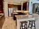 Gourmet kitchen with a central island and stainless steel appliances at 7443 Lake Albert Dr, Windermere, FL 34786