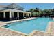 Community pool with covered patio and ample seating for residents to enjoy the sunny weather at 7443 Lake Albert Dr, Windermere, FL 34786