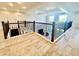 Spacious upper landing with decorative railings, wood floors, and coffered ceilings at 7443 Lake Albert Dr, Windermere, FL 34786