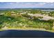 Aerial view of acreage bordered by a lake at 17358 Hwy 27, Clermont, FL 34715