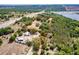 Aerial view of a large lot with a beautiful home featuring a red outline of the property's boundary at 17358 Hwy 27, Clermont, FL 34715