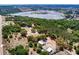 Aerial view of property boundaries showcasing wooded acreage at 17358 Hwy 27, Clermont, FL 34715