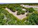 Aerial view of flat cleared property, partially fenced at 17358 Hwy 27, Clermont, FL 34715