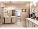 Modern bathroom with a double vanity, marble floors, and plenty of storage space at 17358 Hwy 27, Clermont, FL 34715