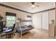 Comfortable bedroom features a bunk bed, desk, wood floors, and ample natural light at 17358 Hwy 27, Clermont, FL 34715