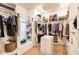 Spacious walk-in closet with custom shelving and abundant storage for clothes, shoes, and accessories at 17358 Hwy 27, Clermont, FL 34715