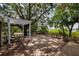Expansive wooden deck featuring a pergola, seating, and offering scenic views at 17358 Hwy 27, Clermont, FL 34715