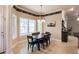 Bright dining room with hardwood floors, decorative walls, with large windows providing an abundance of natural light at 17358 Hwy 27, Clermont, FL 34715