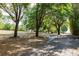 Curved driveway with mature shade trees and landscaping at 17358 Hwy 27, Clermont, FL 34715