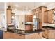 Bright kitchen featuring wood cabinets, a breakfast bar, and modern appliances at 17358 Hwy 27, Clermont, FL 34715