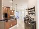 Bright kitchen featuring wood cabinets, a breakfast bar, and modern appliances at 17358 Hwy 27, Clermont, FL 34715