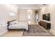 The main bedroom offers hardwood floors, tray ceilings, access to an ensuite, and lots of light at 17358 Hwy 27, Clermont, FL 34715