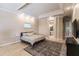 Spacious main bedroom boasts tray ceilings, hardwood floors, and an ensuite bathroom at 17358 Hwy 27, Clermont, FL 34715