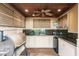 Well-equipped outdoor kitchen complete with sink, fridge, counter space, cabinets, and BBQ at 17358 Hwy 27, Clermont, FL 34715