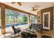 Relaxing screened patio with comfortable seating area and views of the sparkling pool and lush backyard at 17358 Hwy 27, Clermont, FL 34715